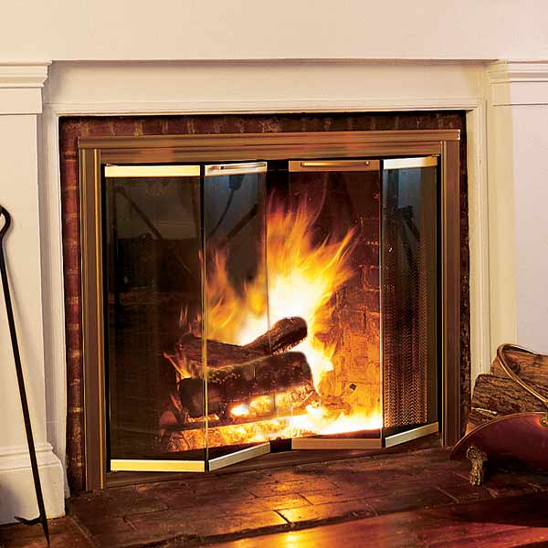 fireplace with roaring fire in a living room