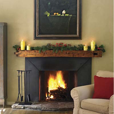 fireplace has a mantel made from salvaged fir beam