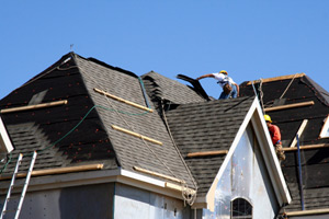workers installing roof
