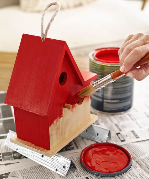 painting a bird feeder red with scraps of drywall corner bead for elevation and support, 10 uses