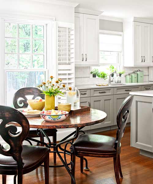 kitchen after redo with breakfast nook with dark dining set and white plantation shutters