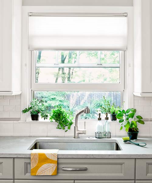 kitchen after redo with honed quartz countertops that look like stone