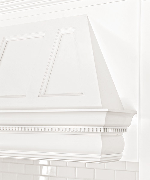kitchen after redo with white range hood trimmed in matching crown molding