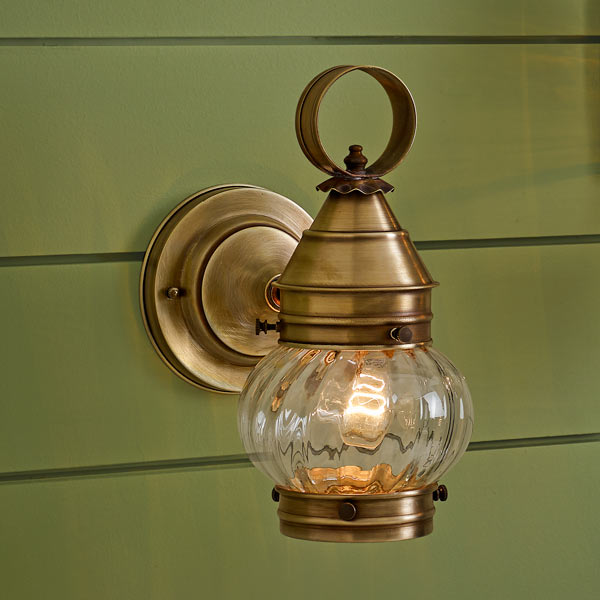 onion-style porch lanterns of solid brass with antiqued finish, handcrafted rippled glass
