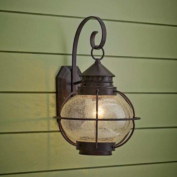 onion-style porch lantern of aluminum with oil rubbed bronze finish and seeded glass