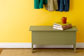 Entryway Benches against a wall with hanging coats