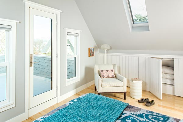 Skylights and a small outdoor space in a remodeled bedroom of the renovated this old house tv cambridge project