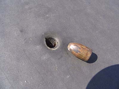 bullet hole in a rubber roof