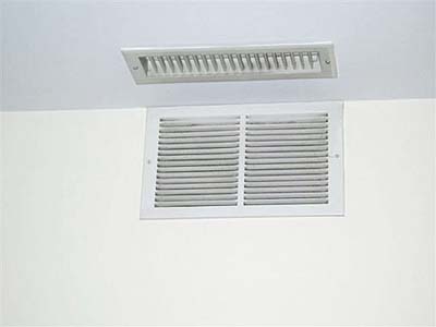 home inspection photo of supply and return vents too close together