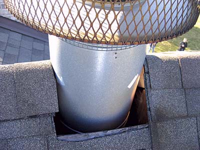 home inspection photo of hole in roof around chimney