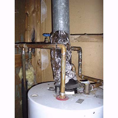 home inspection photo of flue pipe made of aluminum foil
