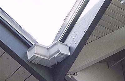 home inspection photo of rain gutter capped at both ends