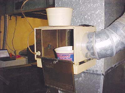 home inspection photo of Cool Whip container in humidifier