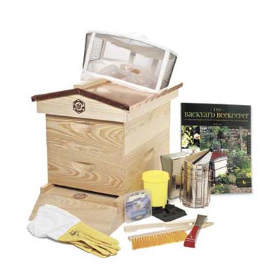 a beekeeper's kit with wooden hive
