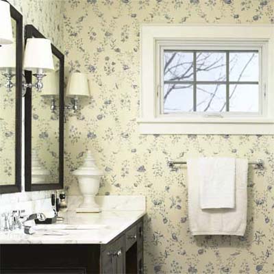 gold marble sink tops brighten this remodeled shingle-style cottage