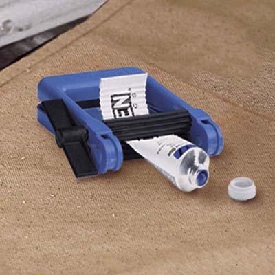 TubeWringer crank squeezing a tube of blue acrylic paint