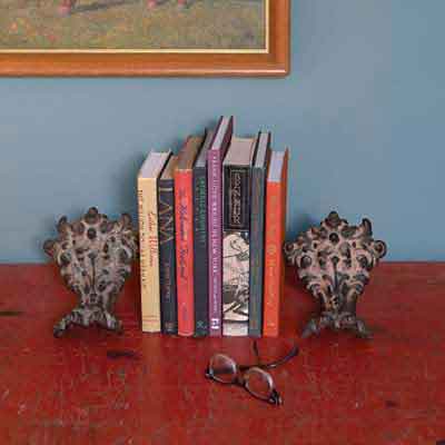 claw-foot tub feet used as bookshelf bookends