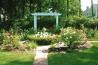 a garden in Newburyport, MA with a pergola and period design