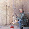 spreading sealer on the crack