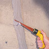 cutting away the injection port with a hacksaw