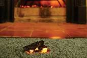 fireplace ember on carpet
