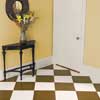 the finished checkerboard-painted wood floor