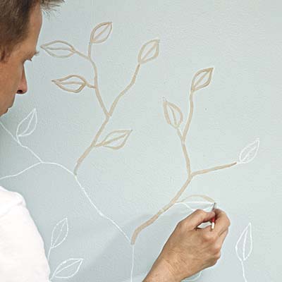paint applied to chalk sketch of leaves and branches