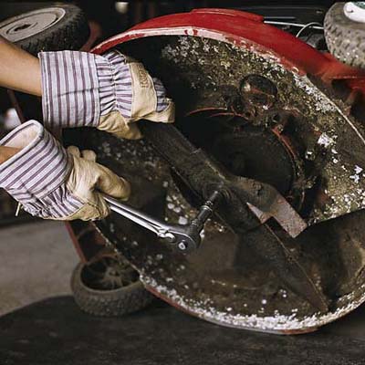 Removing the blade with thick gloves on, and a socket wrench