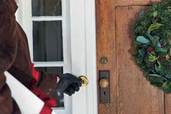 man approaching front door to ring the doorbell