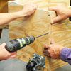 screwing the outer wall to the sides of the tool bench