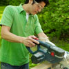 man using miter saw