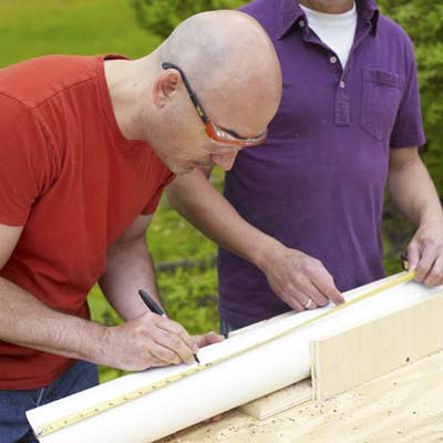 Man marking a straight cut 