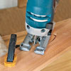 Mark Powers uses a jigsaw to cut handles into a tray area for a bar cart