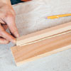 Mark Powers gluing ledges into a tray area for a bar cart
