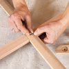 Mark Powers attaches the sides of the bar cart