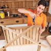 Mark Powers attaches the crosspieces to the bottom tray of the bar cart