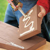 applying construction adhesive to boards