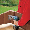 screwing the hinges to the frame with a drill/driver