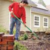 raking the soil to create a level bed where the cold frame will be placed