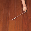 hand marking design on wood floor in preparation for painting medallion