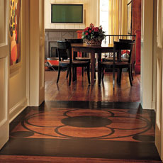 wood floor with painted framed medallion in hallway