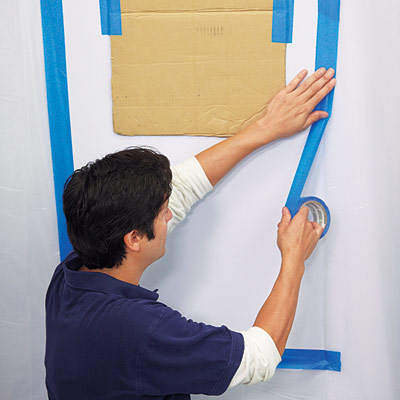 man prepping foyer for wall niche installation