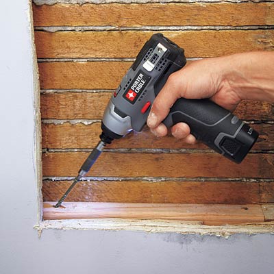 man securing the blocking for wall niche installation