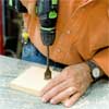 this old house general contractor drilling recesses for the spacers while building a freestanding lamp
