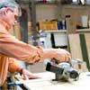 this old house general contractor cutting the base and feet while building a freestanding lamp