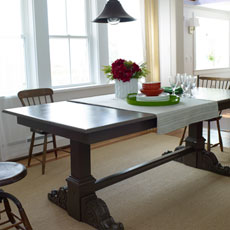 a finished trestle table in a dining area