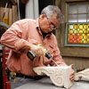 Tom Silva drills a recess into the corbel for a trestle table using a drill/driver with a 5/8-inch paddle bit
