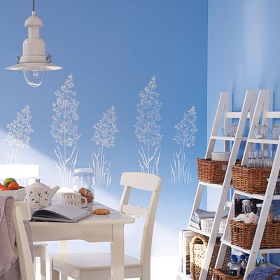 a blossom motif stencil in different sizes on the walls of a dining area