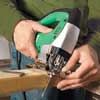 Mark Powers cutting a framing piece for his trash shed's framing using a jigsaw