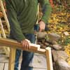 Mark Powers building front supports for his trash shed